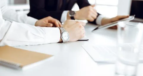 Unknown business people using tablet computer in modern office. Businessman or Stock Photos