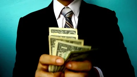 Unknown businessman counting dollars bills. Man calculating american bankno.. Stock Footage 266473253