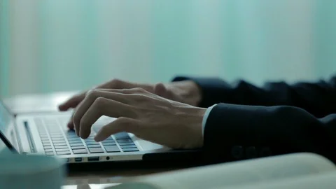 Unknown businessman in suit hard working using laptop in the office Stock Footage 88022020