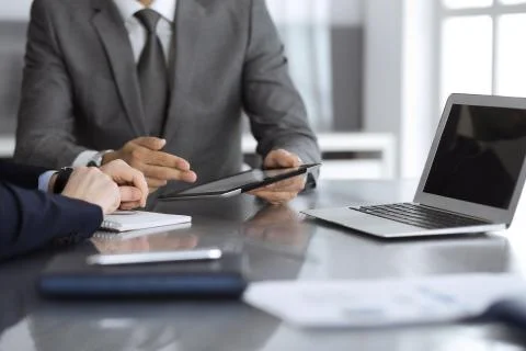 Unknown businessman using tablet computer and working together with his Foto stock