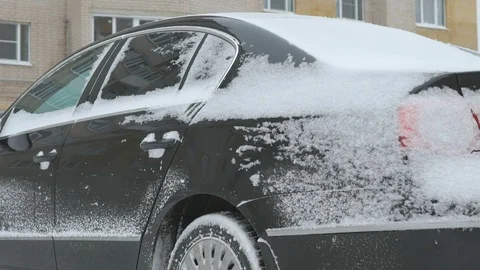 Unknown car covered with snow in the yard Stock Footage 83228572