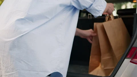 Unknown Caucasian pensioner buyer shopper driver customer car driver auto owner Stock Footage 296194268