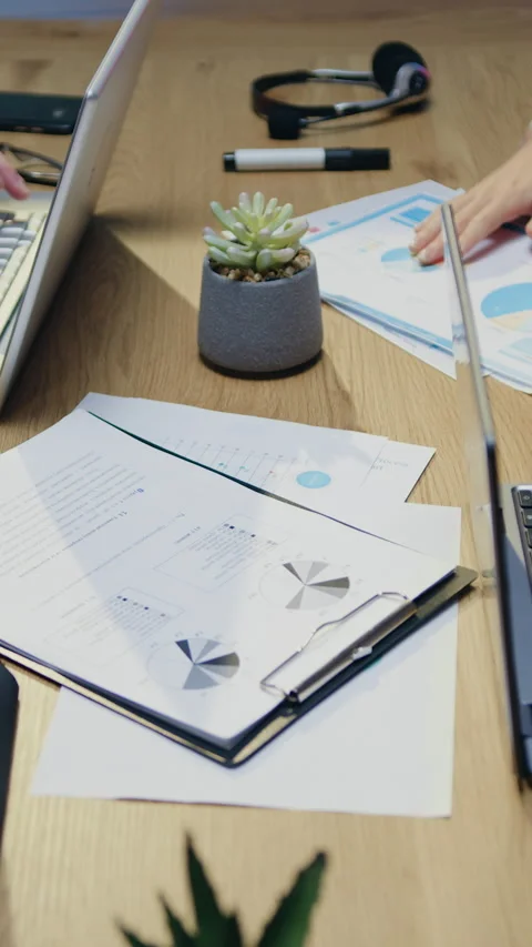 Unknown confident responsible men and women working together at workplace with p Stock Footage 329186618