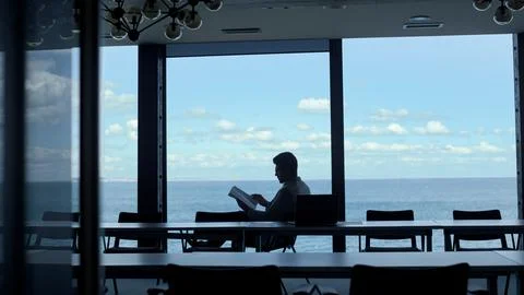 Unknown director reading papers at ocean view. Anonymous manager checking report Stock Photos