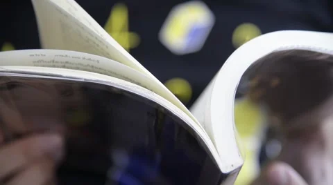 Unknown fat man reading pocket book closeup Stock Footage 63043653