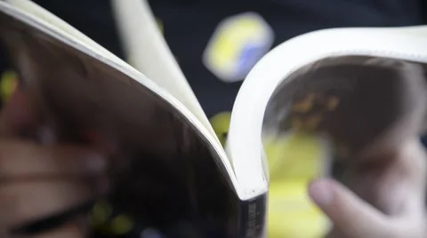 Unknown fat man reading pocket book closeup Video stock 63043678