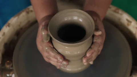 Unknown human working by pottery wheel with raw clay Stock Footage 304223467