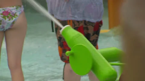 Unknown Kid Spraying Water Gun at Waterpark Video stock 24672359