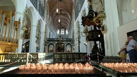 Unknown Location - February 8, 2026: Candles Light Interior of Grote Kerk Church Stock Footage 328480273