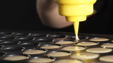 Unknown man chef preparing round pancakes on a hot surface Stock Footage 321055038