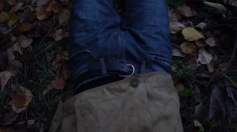 Unknown man drags a young boy on the ground. Post-apocalyptic world. Stock Footage 68205650