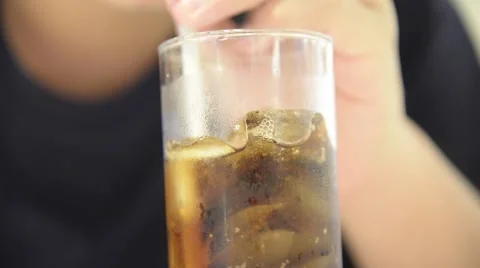 Unknown man drink a glass of iced cola Video stock 63205189