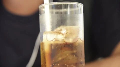 Unknown man drink a glass of iced cola Stock Footage 63205651