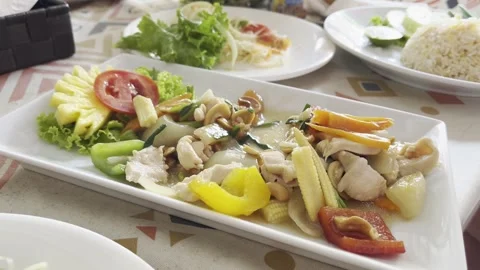 Unknown man eats chicken with vegetables, close-up. Stock Footage 311981565