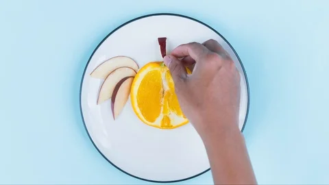 Unknown man hand making owl from slices fruits Stock Footage 130059582