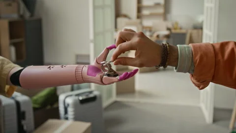 Unknown Man Handing Keys to New Apartment to Anonymous Girl with Bionic Arm Stock Footage 323297373