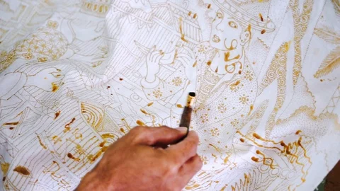 Unknown man hands make batik and using a Canting Stock Footage 124324104