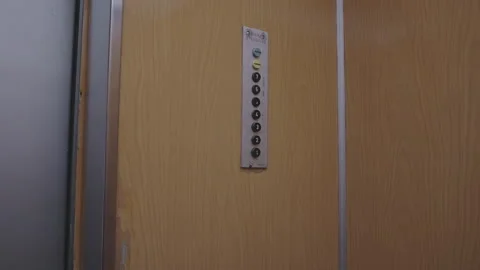 Unknown man's hand presses the button on floor one in an elevator. Stock Footage 293258968