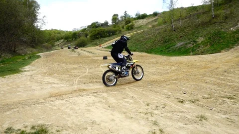 Unknown motorcycles train on mountainous terrain. Slow motion. Stock-Footage 129380062