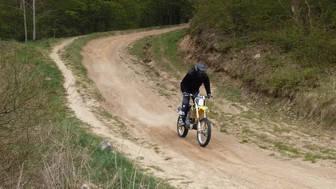 Unknown motorcycles train on mountainous terrain. Slow motion. Stock Footage 129381463