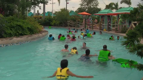 Unknown People Floating-by in Waterpark Lazy River Stock Footage