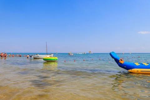 Unknown people having fun in the Black sea in Lazurne, Ukraine Stock Photos