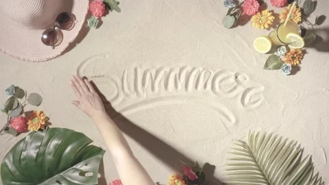 Unknown person erasing the word summer with her hand written on a sandy beach Stock Footage 155112804