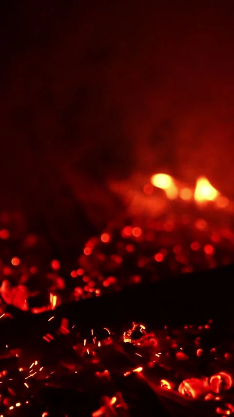 Unknown person moving the fire burning out. Stock Footage 308306685