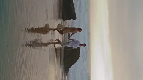 Unknown spouses walking sea beach. Love pair enjoying date vertical oriented. Stock Footage 247207719
