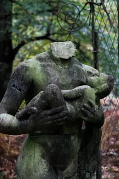 Unknown statue in a forest Stock Photos