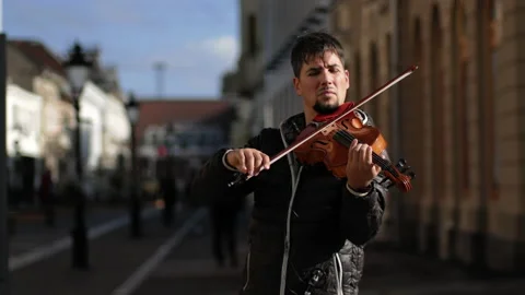Unknown street violin player Stock Footage 143487759