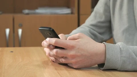 Unknown student holding black smartphone 스톡 동영상 84238906