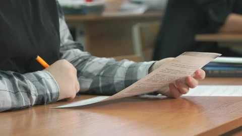 Unknown student reads text on the sheet Stock Footage 94132453