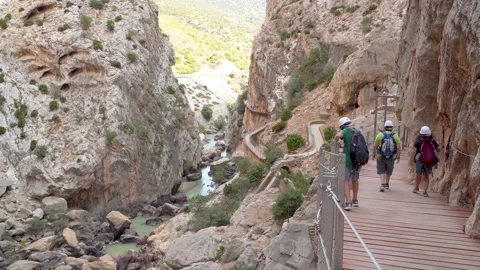 Unknown Tourists Exploring Caminito Del Rey, Wearing Helmets, Walking on Trail Stock-Footage 146585344