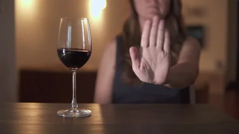 Unknown woman is refusing wine. Sober lifestyle Stock Footage 322876053