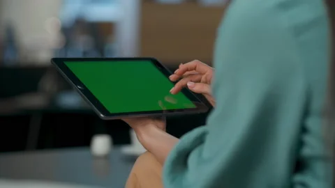 Unknown woman touching mockup tablet in office. Developer working chromakey tab 스톡 동영상 227620641