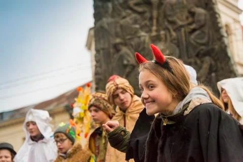 Unknown young actor in role devil plays for the citizens in a Christmas perfo Stock Photos