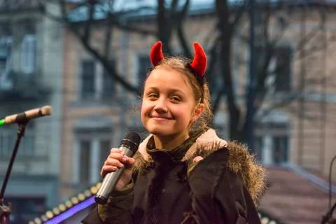 Unknown young actor in role devil plays for the citizens in a Christmas perfo Stock Photos