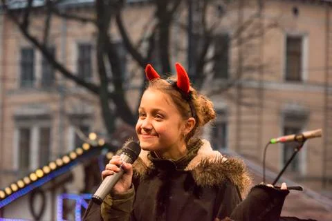 Unknown young actor in role devil plays for the citizens in a Christmas perfo Stock Photos
