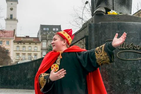 Unknown young actor in role king plays for the citizens in a Christmas perfor Stock Photos