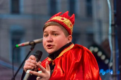 Unknown young actor in role king plays for the citizens in a Christmas perfor Stock Photos