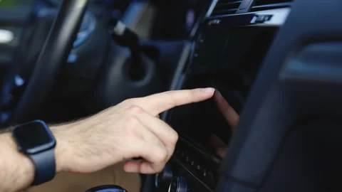 Unknown young man sitting in front of the handlebar of his own luxury auto and Stock Footage 200875825