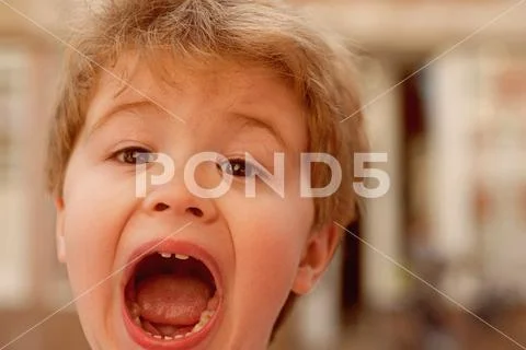 Unleashing his emotions. Little child with stylish haircut. Little child with Stock Photos