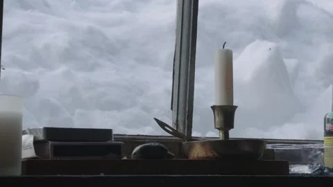Unlit Candle In Window Of Log Cabin Snow Outside Stock Footage 154054761