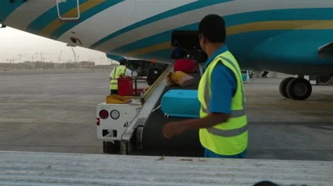 Unload Baggage On Conveyor Stock Footage 62202911