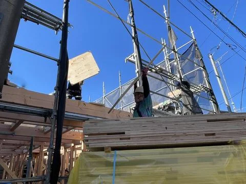 Unloading building materials at the construction site of a new house in Japan Stock Photos