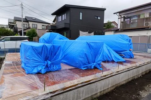 Unloading Building Materials at Construction Site Stock Photos