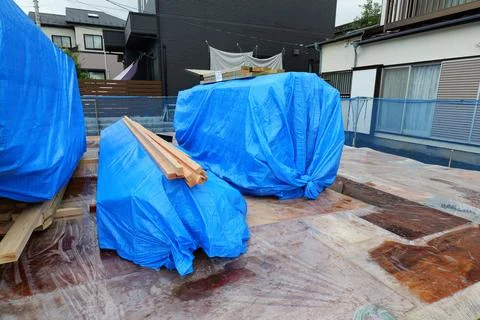 Unloading Building Materials at Construction Site Stock Photos