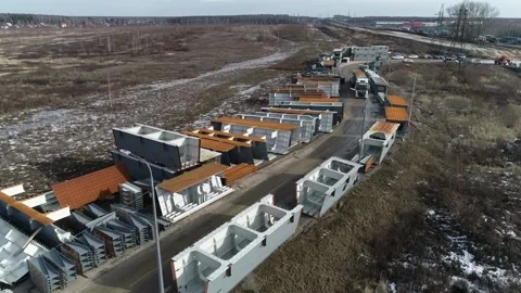 Unloading of building materials by crane at the construction site aerial Vidéo 172556131