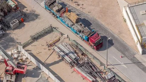 Unloading of building materials by crane at the construction site aerial ti.. Fotos Stock
